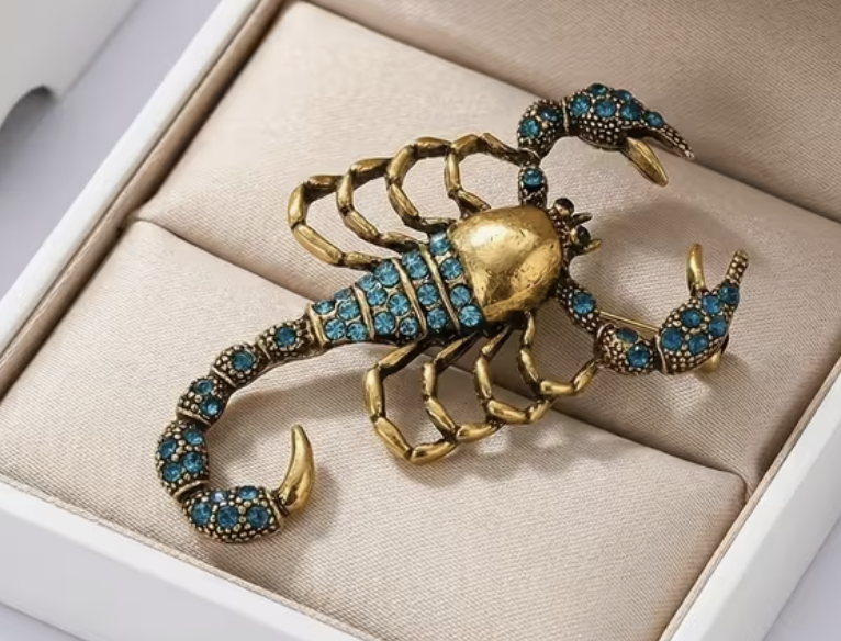 Antique gold scorpion brooch set with turquoise crystals